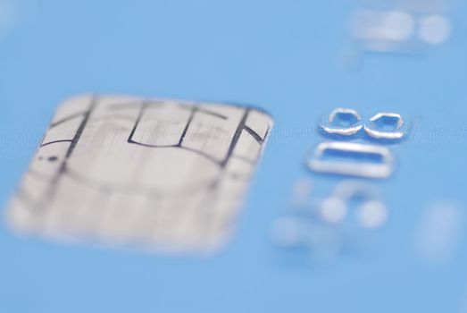 Macro images of debit card. Focus on numbers and Chip.