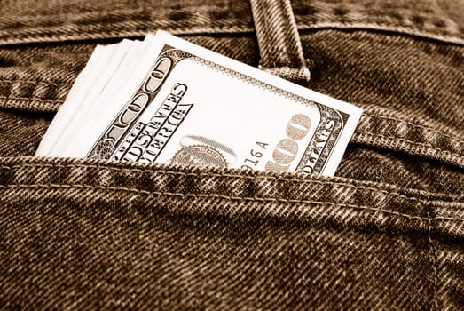 Lot of dollars in a pocket of jeans.