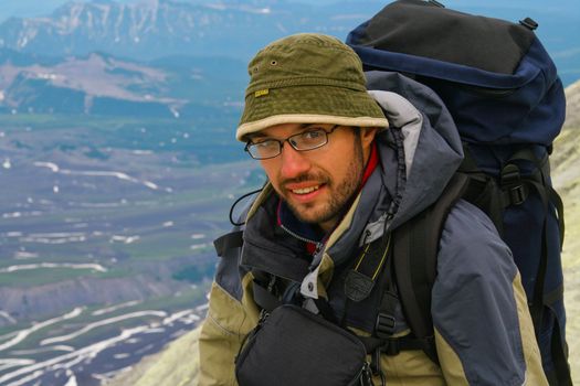 Tourist makes ascent on one of the vulcano; Kamchatka