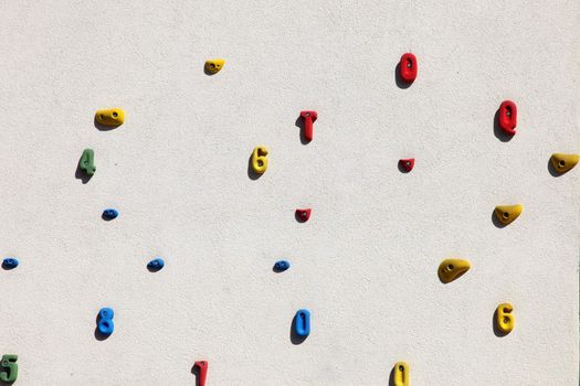 Grungy surface of an artificial rock climbing wall