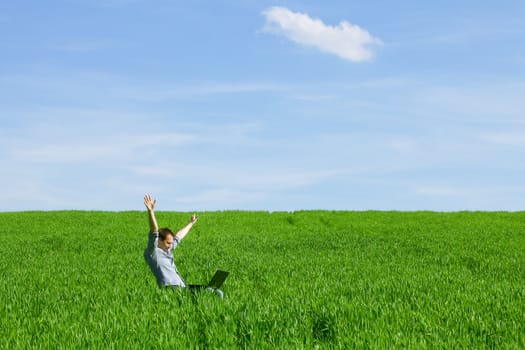 Young man using a laptop outdoors