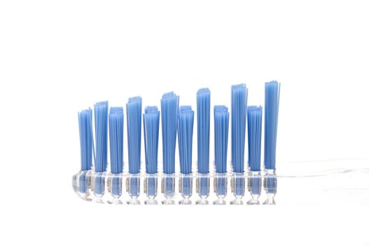 Close up toothbrushes over white background
