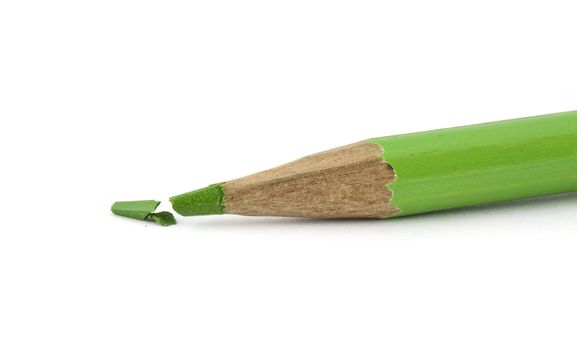 Broken green pencil isolated on white background