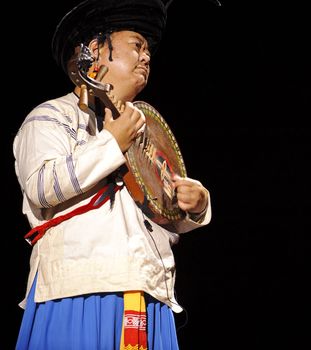 CHENGDU - SEP 26: chinese Yi ethnic musician perform on stage at JIAOZI theater.Sep 26,2010 in Chengdu, China.