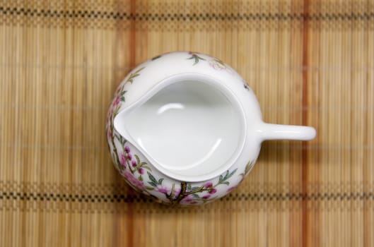 chinese teacup on straw mat