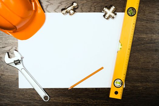 plumbing tools on a white sheet of paper, place for text