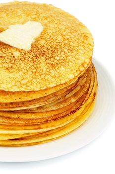 Stack of Delicious Thin Pancakes with Piece of Butter on White Plate closeup 