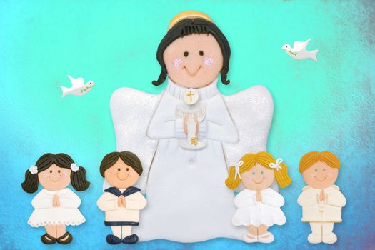 cheerful first communion card, angel with children of sugar on colorful background