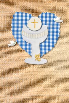 cute card first communion, chalice in burlap rustic background