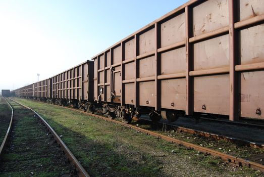 Railway freight wagons train, lines and perspective