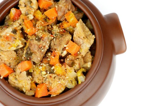 Beef Stew with Carrot, Potato, Leek and Herbs in Brown Pot isolated on white background. Top View