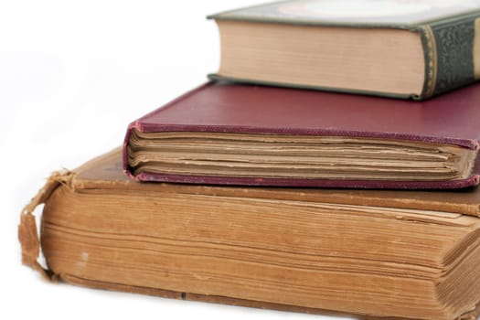 Stack of antique books on isolated background