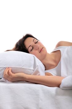 A young woman sleeps in her bed. All on white background.