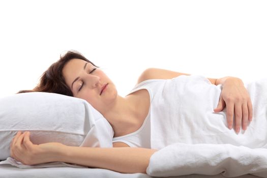 A young woman sleeping in her bed. All on white background.