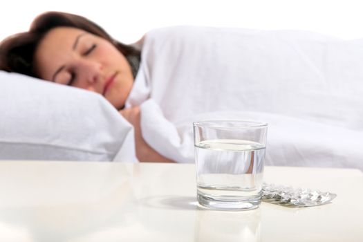 A young woman is sleeping in the bed. All on white background.