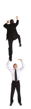 Two young business men climbing upwards. All isolated on white background.