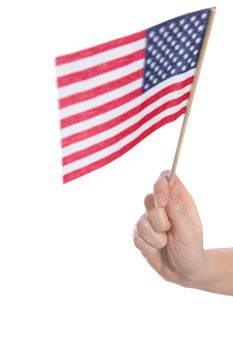 A human hand holding a flag of the United States of America. All isolated on white background.