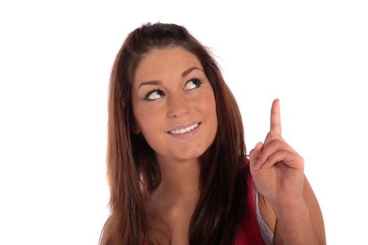 An attractive young woman pointing at something. All isolated on white background.