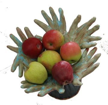 pottery hand holding ripe apples