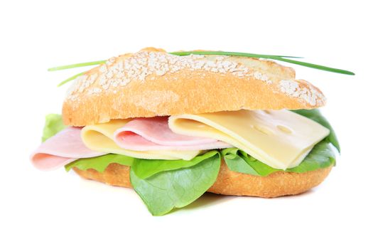 Fine served french roll with boiled ham and cheese. All on white background.