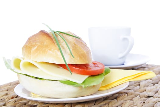 Fine served wheat roll with cheese. All on white background.