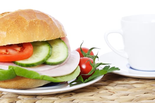 Fine served wheat roll with boiled ham. All on white background.