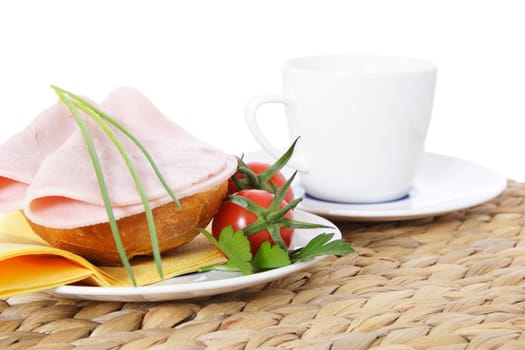 Fine served half wheat roll with boiled ham. All on white background.