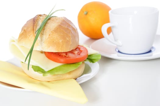 Fine served wheat roll with cheese. All on white background.