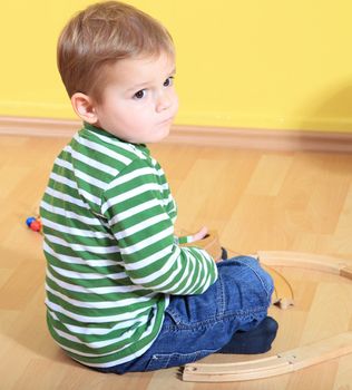 Cute caucasian toddler in kindergarten.