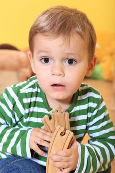 Single kid playing in kindergarten.