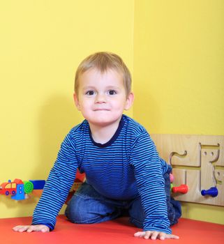 Cute european toddler in kindergarten.