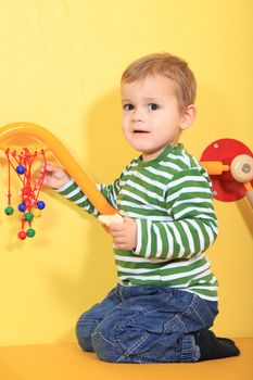 Cute european toddler in kindergarten.