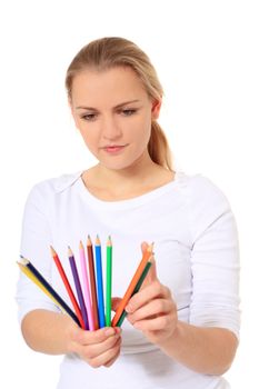 Attractive blond woman uncertain about the right color. All on white background.