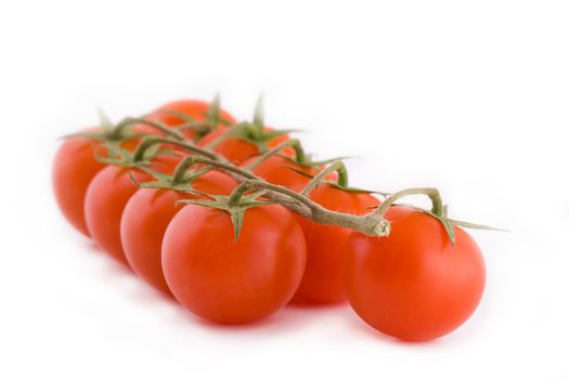 Bunch of fresh small cocktail tomatoes isolated