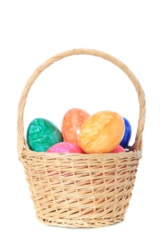 Colored easter eggs in a basket. All on white background.