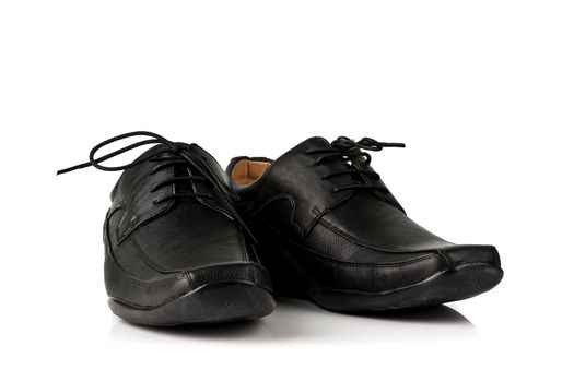 Elegant black leather men's shoes on white background with shadow.