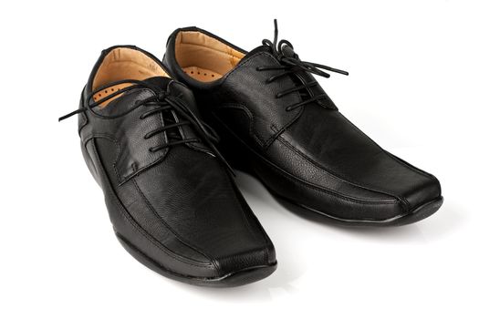 Elegant black leather men's shoes on white background with shadow.