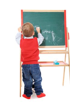 Cute caucasian toddler doodling. All isolated on white background.