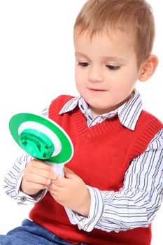 Cute caucasian toddler playing. All isolated on white background.