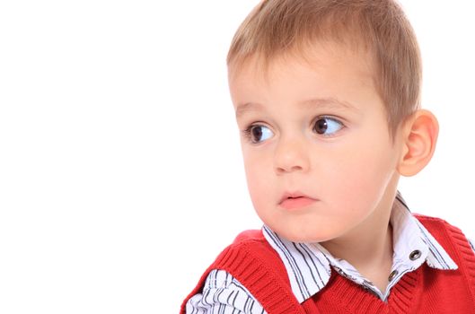 Cute caucasian toddler looking to the side. All isolated on white background. Extra copy space on left side