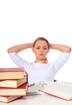 Attractive blonde student suffering from examination stress. All on white background.