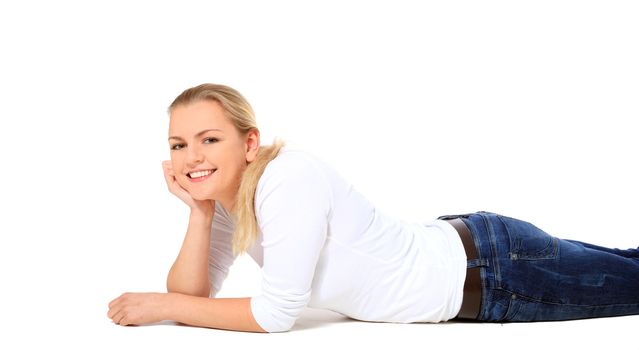 Attractive blond woman lying on floor. All on white background.