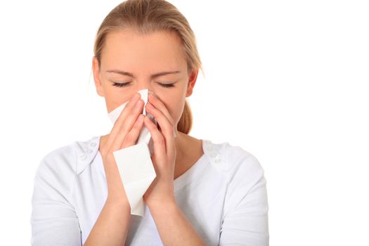 Attractive blonde woman using tissue. All on white background.