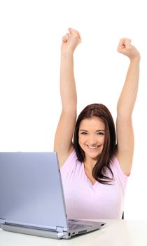 Attractive teenage girl cheering while using her notebook computer. All on white background.