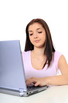 Attractive teenage girl got a problem with her computer. All on white background.