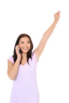 Attractive teenage girl cheering during phone call. All on white background.