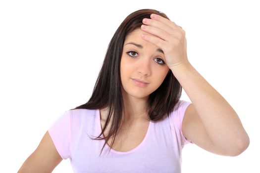 Attractive teenage girl suffering from a headache. All on white background.