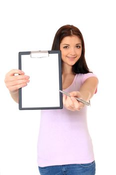 Attractive teenage girl pointing at clipboard. All on white background.