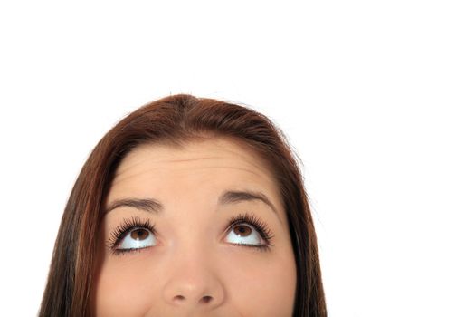 Attractive teenage girls eyes looking to the top. All on white background.