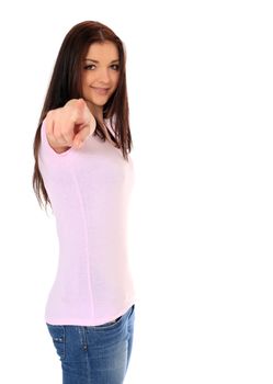 Attractive teenage girl pointing with finger. All on white background.